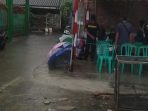 Hujan dan Banjir Tidak Surutkan Warga Gunakan Hak Pilih